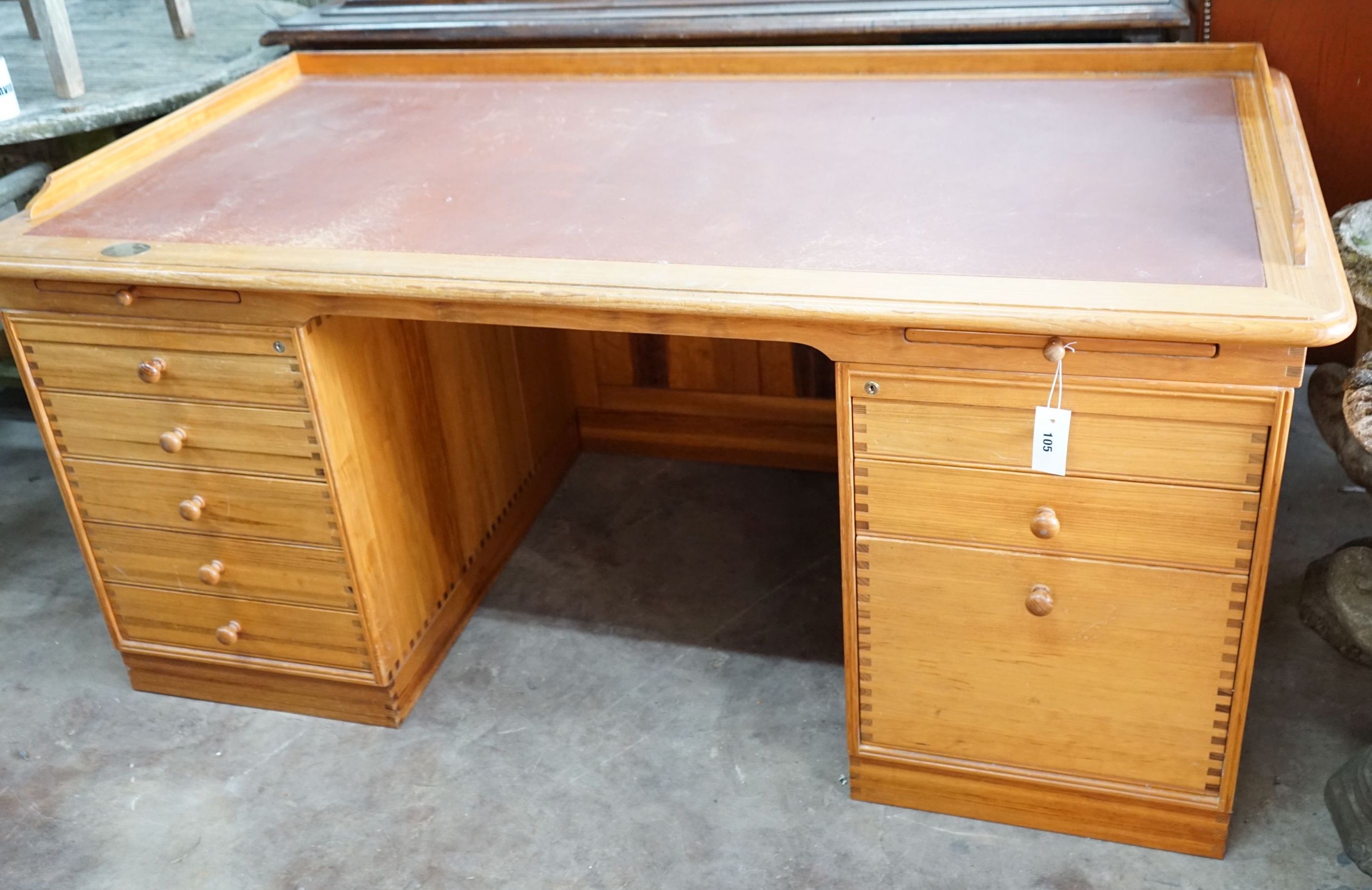 A Finn Hansen Danish pine kneehole pedestal desk with opposing drawers and cupboards, length 168cm, depth 88cm, height 78cm